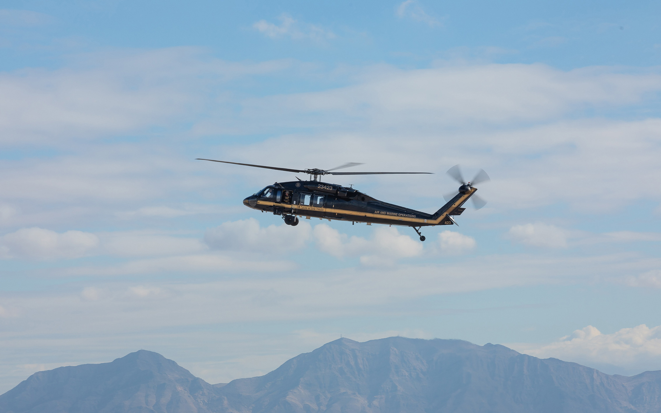 Helicopter above mountains