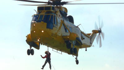 Sea king rescue helicopter and winchman