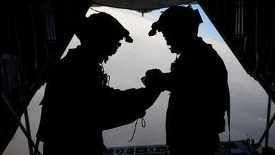 U.S. Air Force loadmasters with the 81st Expeditionary Rescue Squadron