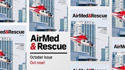 red helicopter in flight