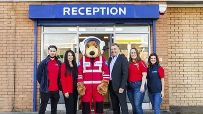 Simmy Akhtar AAUK CEO, (2L) and Roger Griggs, Kwik Fit communications director (3R) join the AAUK partnership team to announce the new relationship