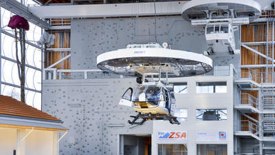 Rescue hoist trainer being installed in a helicopter pilot training facility