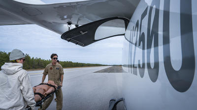 Image of test training with helicopter and stretcher