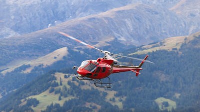 Image of air ambulance flying over countryside