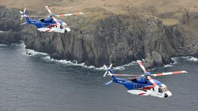 Image of Bristow helicopter flying over sea