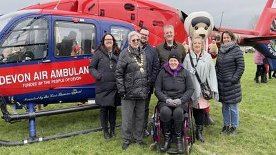 Image of Devon Air Ambulance crew standing in front of air ambulance