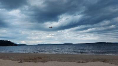 Image of helicopter over water