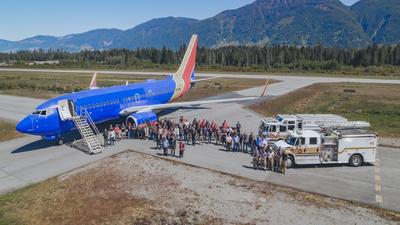 Coulson Aviation welcomes the newest addition to its aerial firefighting fleet, a Boeing 737-700, with a water cannon salute