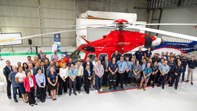 Image of Queensland Government Air team in front of aircraft