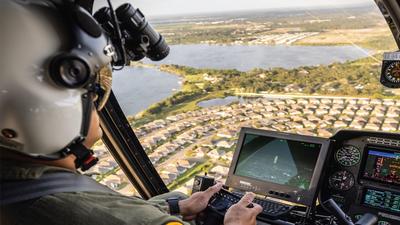 Image of Robinson Helicopter R66 helicopter midair