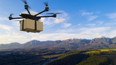 Drone delivery concept. Autonomous unmanned aerial vehicle used to transport packages.