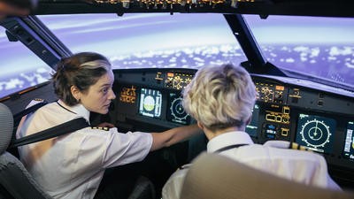 Female helicopter pilot training student
