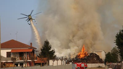 Helicopter putting out fire in town