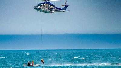 Air rescue helicopter saving stranded people