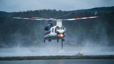 Helicopter flying over water