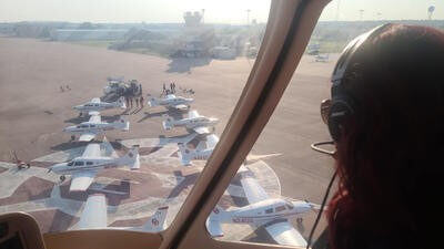 Brandi Rector looking out of helicopter