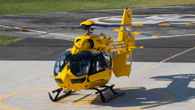 Yellow helicopter parked