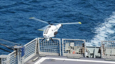 Drone flying above ship deck