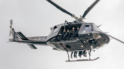LAPD helicopter with police sitting on side