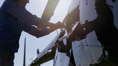 Person working on helicopter