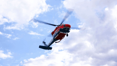 Red and blue Australian Sikorsky Firefighting helicopter