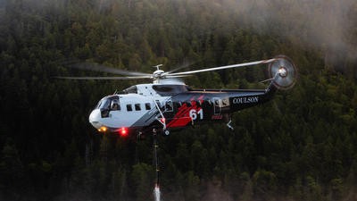 Firefighter helicopter picking up water