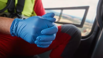 Paramedic in the zone, in helicopter with hands together