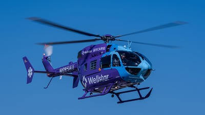 Wellstar purple and blue helicopter