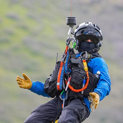 Man on hoisting out of helicopter