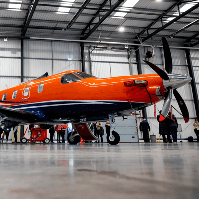 Orange Skycare fixed-wing plane