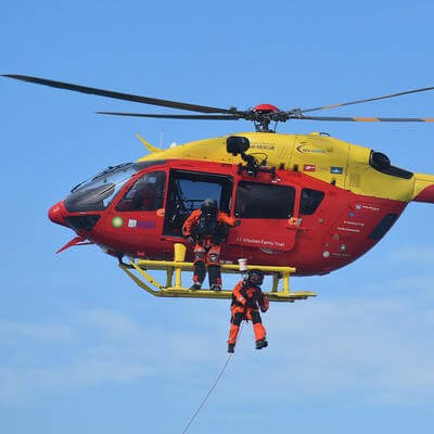 Recue workers hoisting out of helicopter