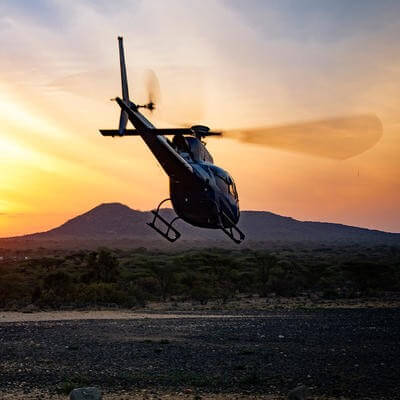Helicopter landing in Africa countryside