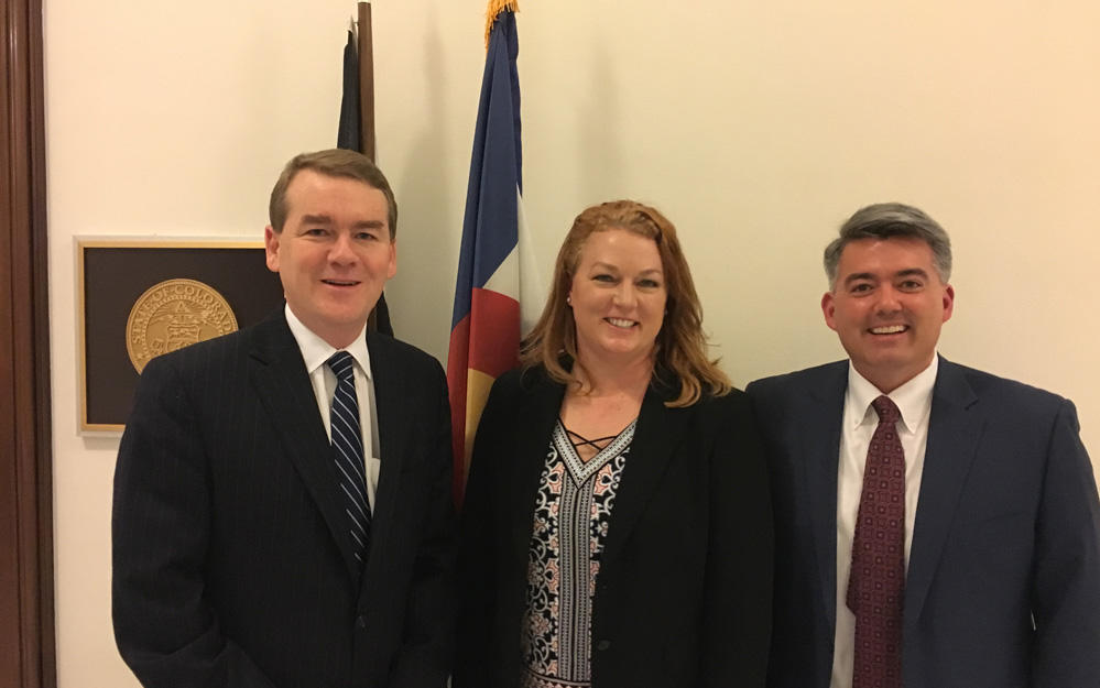 Karen Mahaney with two senators