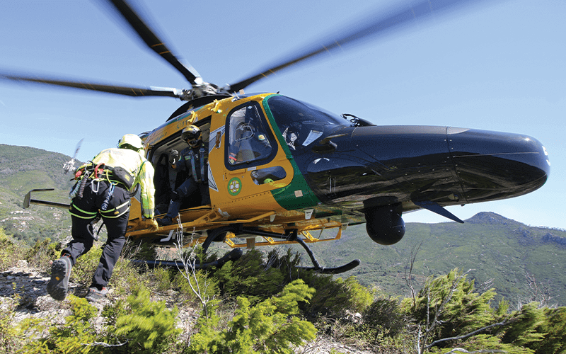 Paramedic getting in helicopter