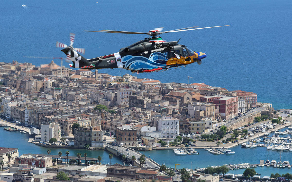 Helicopter flying above sea