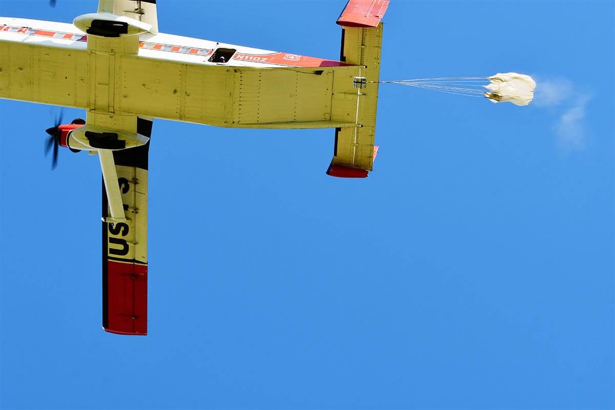 Aerial firefighting plane dropping fire retardant