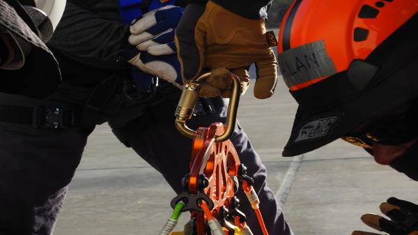 Air rescue systems team prepare air rescue equipment