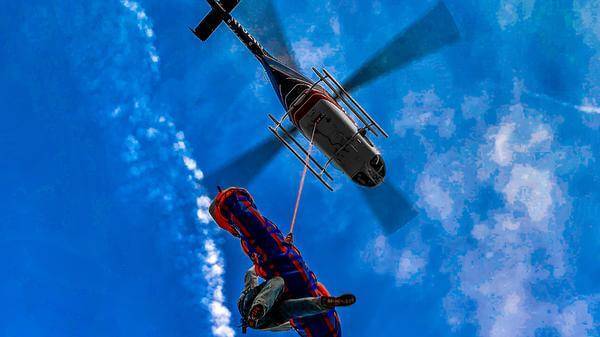 Helicopter flies with rescue team and air lifted patient