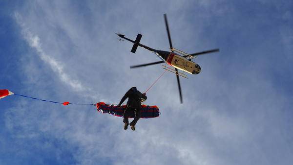Helicopter with air rescue operator