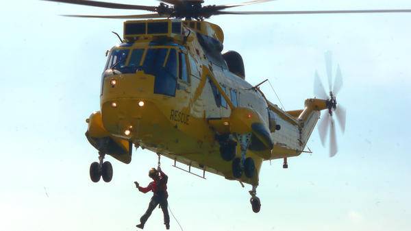 Sea king rescue helicopter and winchman