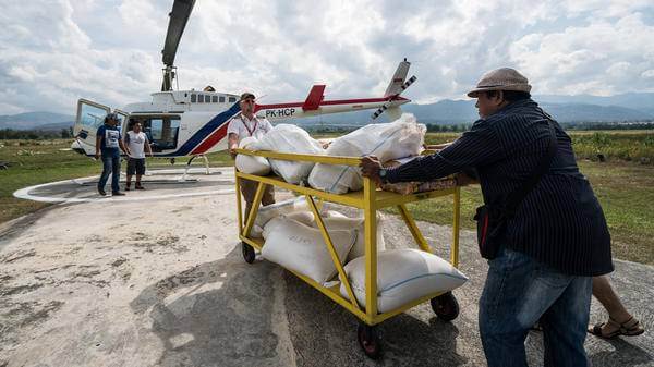Goods being distributed by helicopter