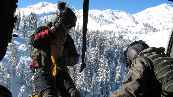 Helicopter hoist winchman and SAR technician