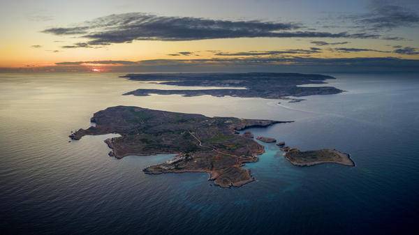 Aerial view of Gozo, with Camino Island in the background
