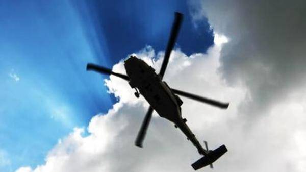 Helicopter in the clouds