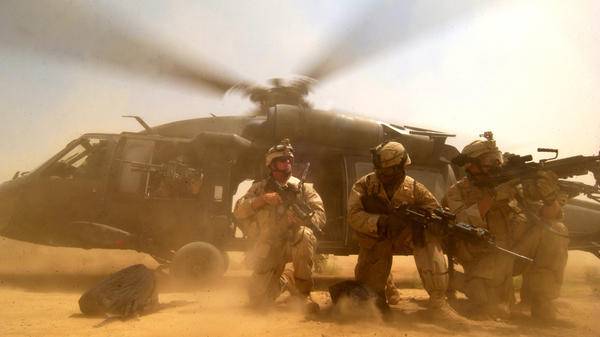 UH 60 Black Hawk kicks up dust 