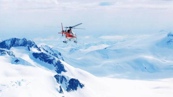 helicopter snowy mountains