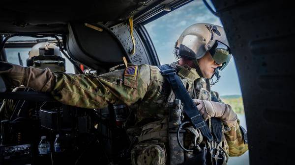 An aircrew member looks over as Nashville Fire Department’s helicopter-borne Aquatic Rescue Team performs a water rescue mission 