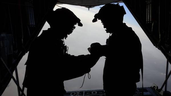 U.S. Air Force loadmasters with the 81st Expeditionary Rescue Squadron