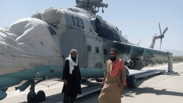 Taliban forces around a seized helicopter