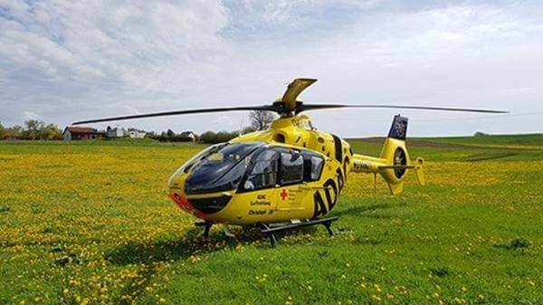 ADAC Christoph 20 helicopter in a field